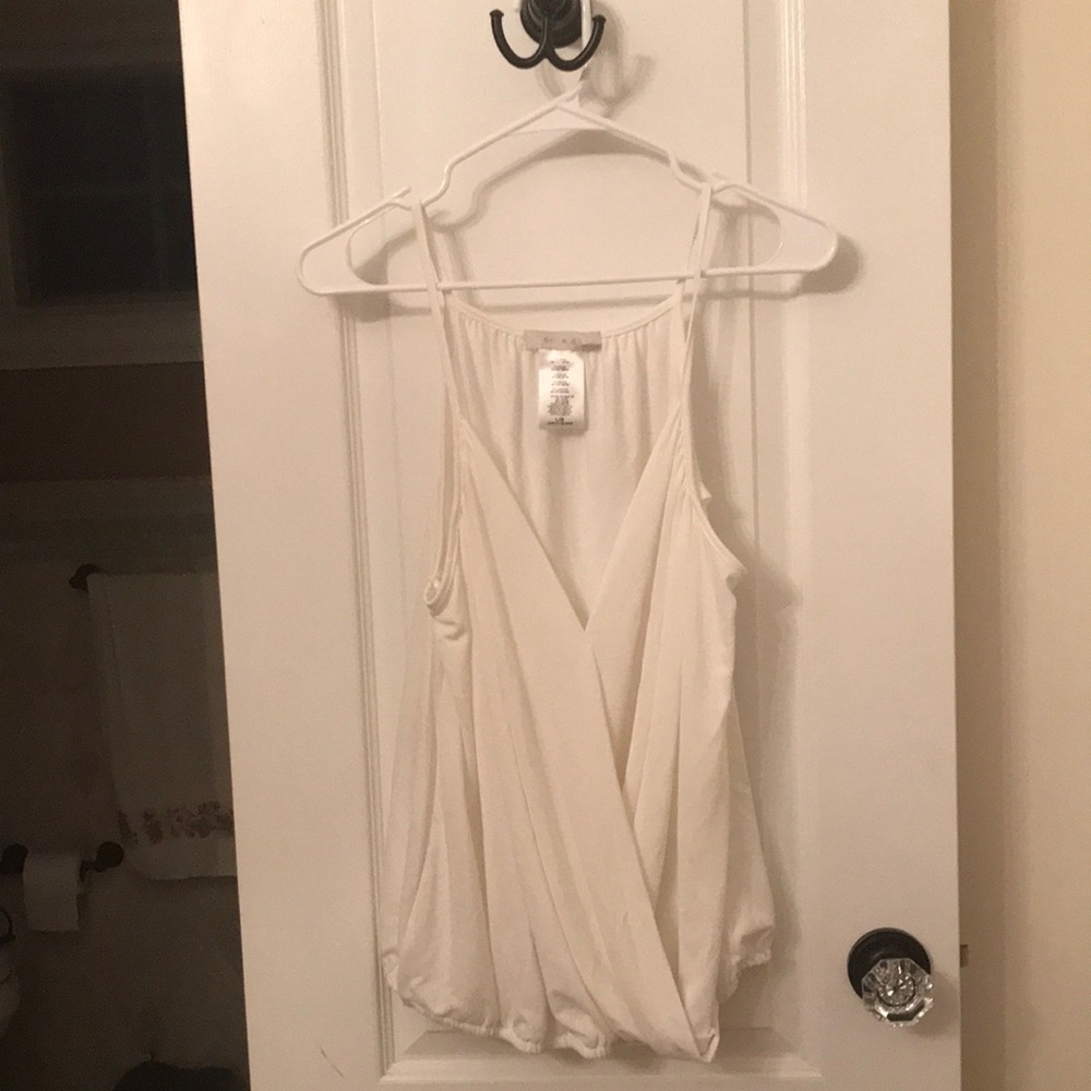 Anthropologie top by eri + Ali is a size large for sale!